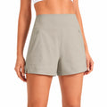 Short femme M en tissu gris kaki taille haute avec poches zippées
